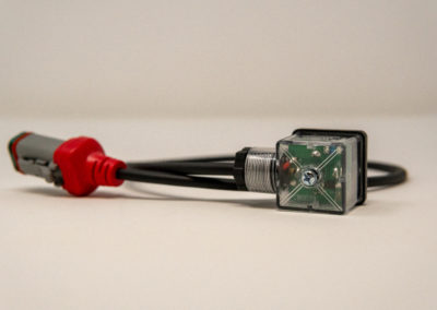 Cable assembly with red DT connector and sealed electronic module
