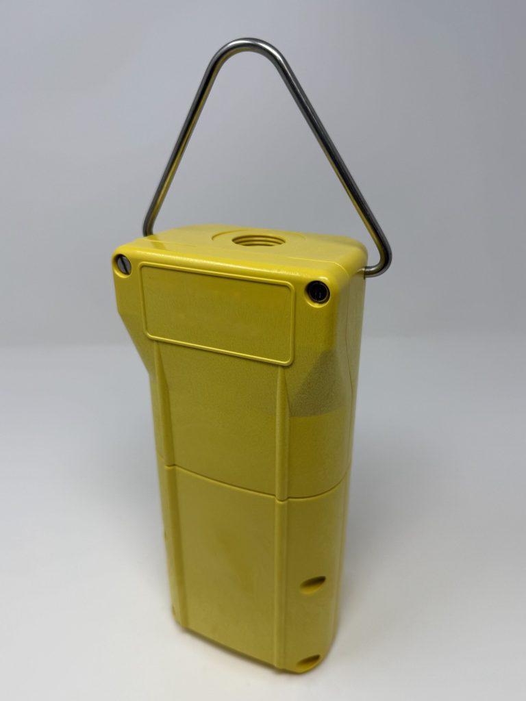 Molded yellow pendant enclosure, back three-quarter view