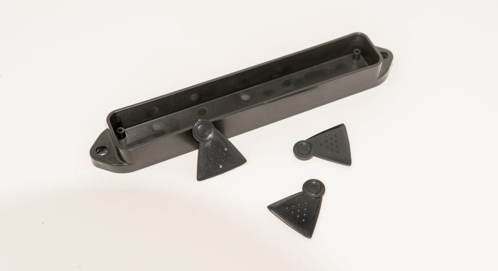 Black molded plastic channel with end caps