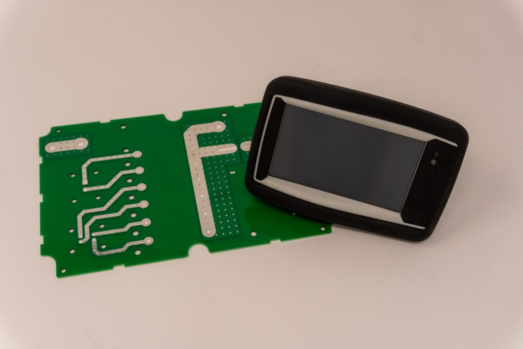 Circuit board with molded display enclosure