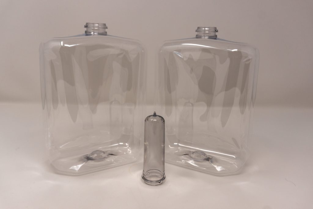 Clear stretch blow molded bottles with preform