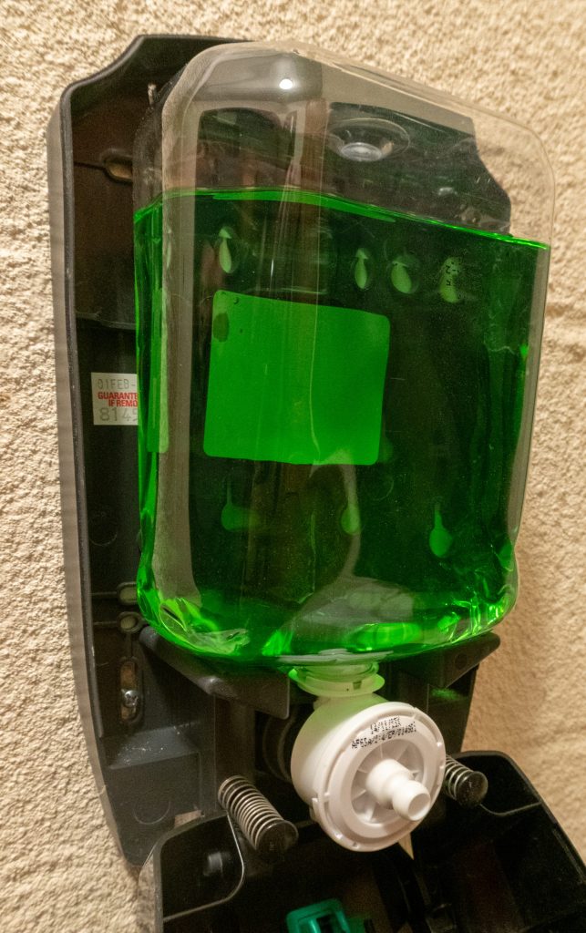Green injection stretch blow molded bottle