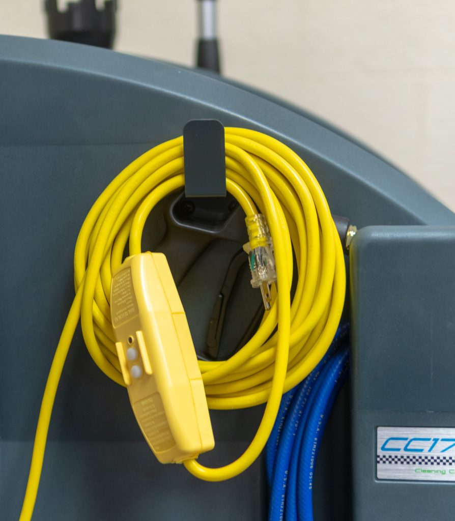Molded cord hook holding an extension cord