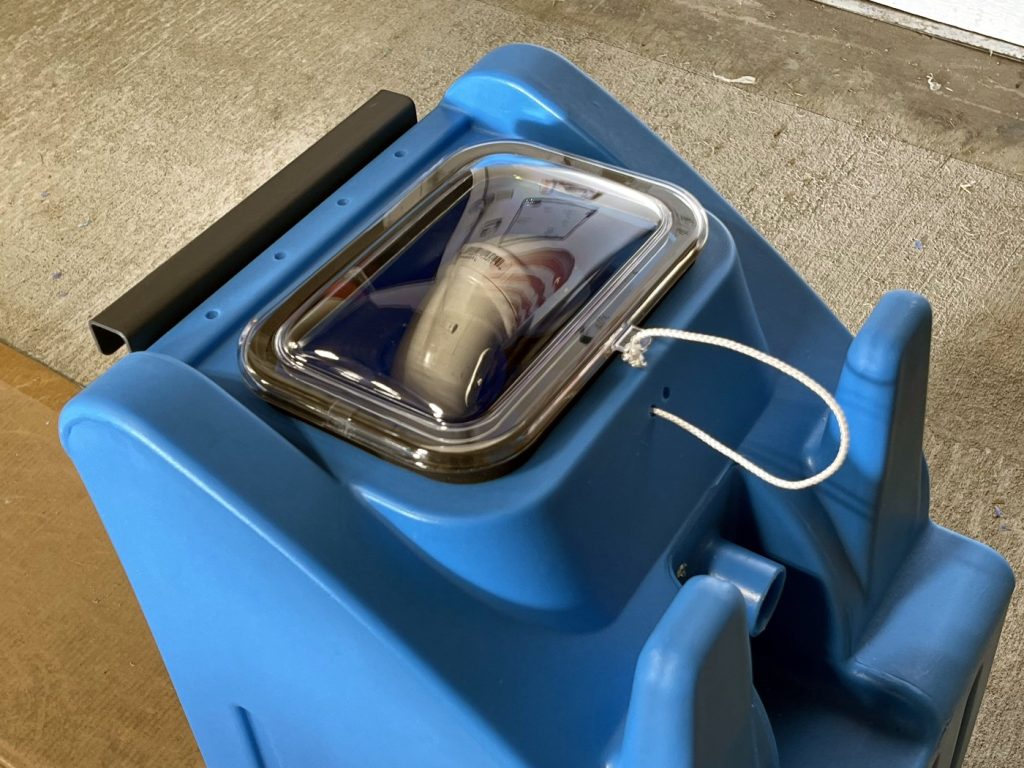 Blue rotationally molded tank with a clear lid