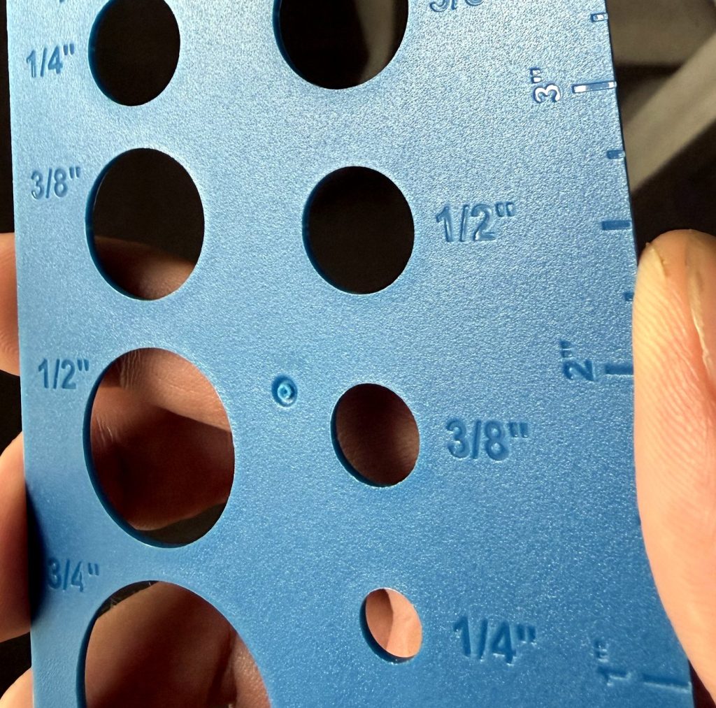 Injection molded tube sizing gauge with labeled holes for 1/4 to 3/4 inch tubing