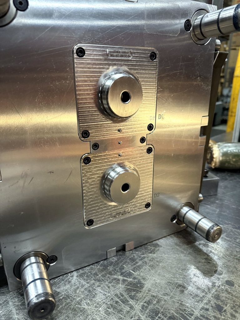 Two-cavity injection mold tool
